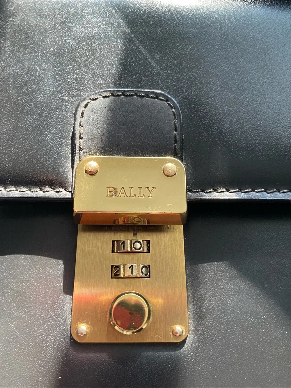 Bally Vintage Black Leather Clutch with Gold Lock and hidden strap